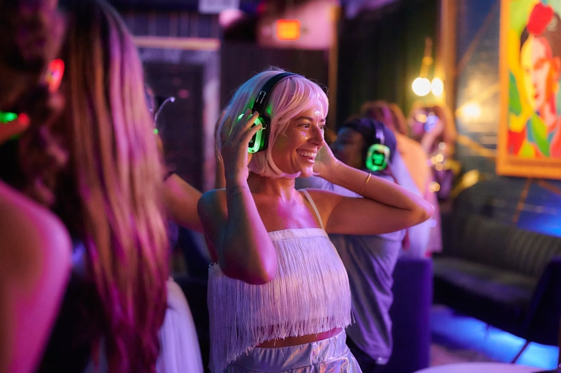 People enjoying silent disco with headphones