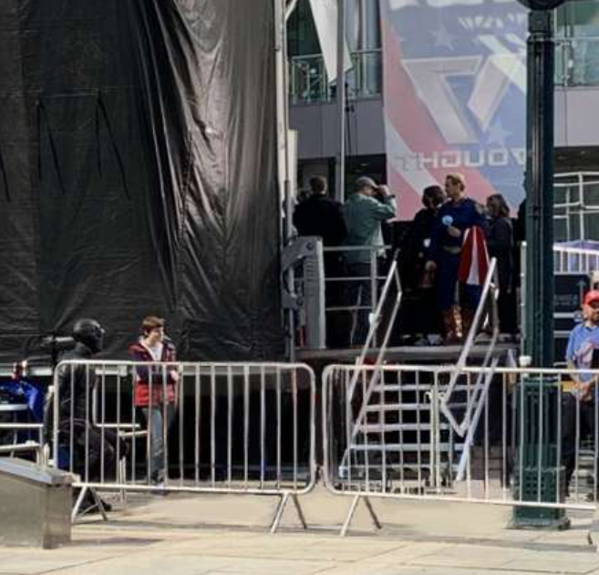 Black Noir and Ryan Homelander hanging out while Homelander does stuff on stage.