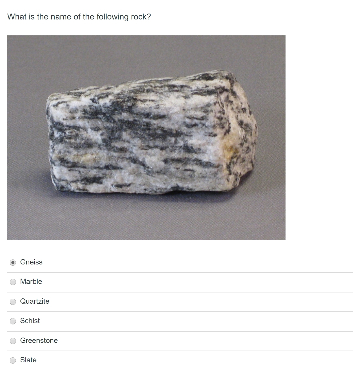 Solved What is the name of the following rock? • Gneiss O | Chegg.com