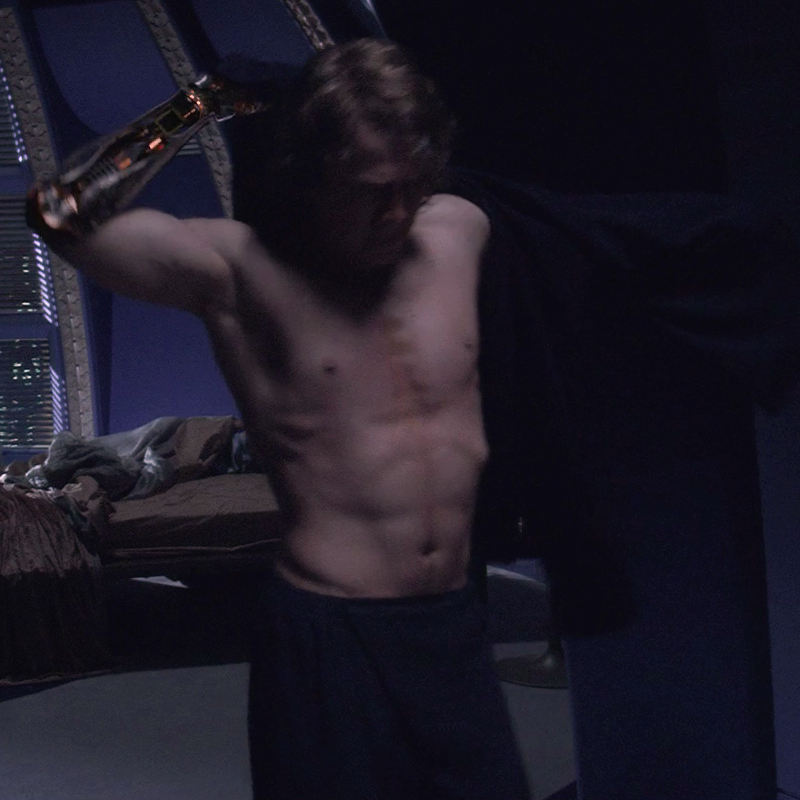 Anakin Skywalker, a Human male, displays defined chest muscles beneath his ...