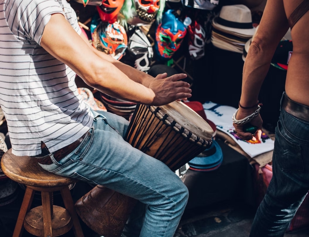 Djembe drummer performing at a party