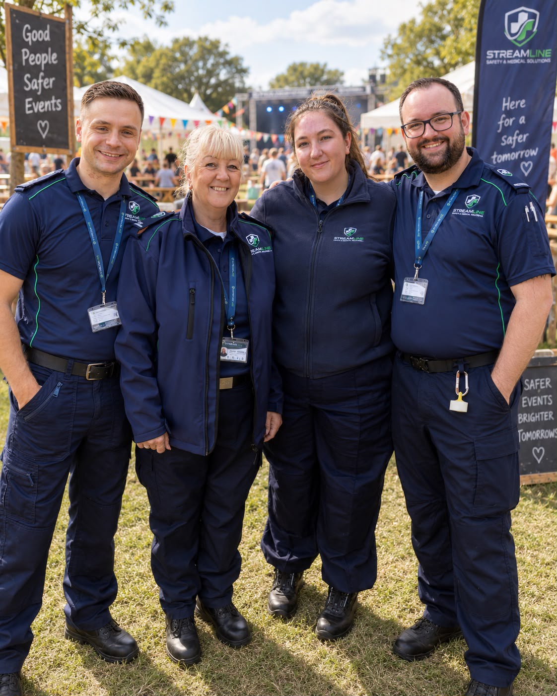 Four members of the Streamline team in uniform at an outdoor event